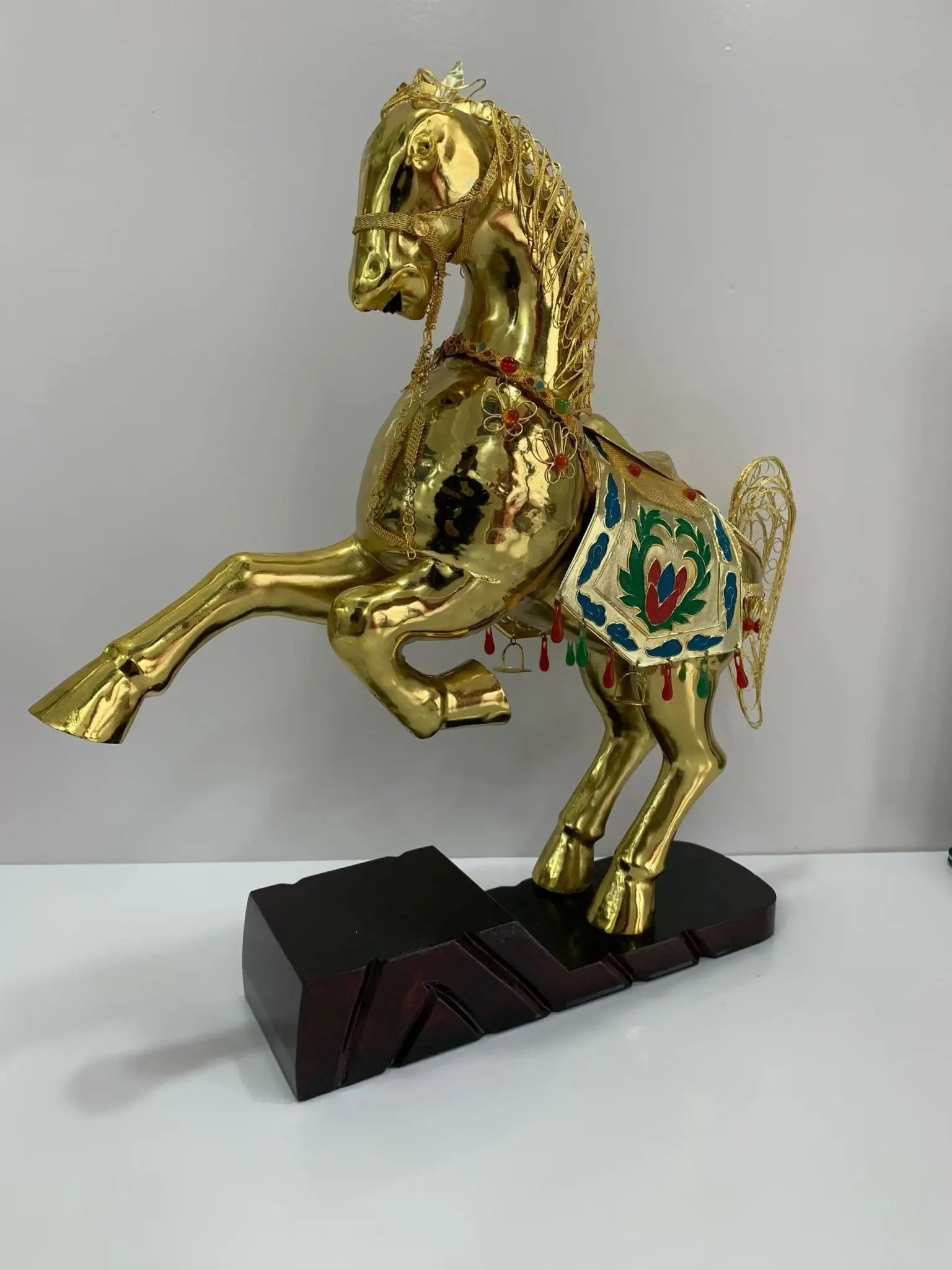 Side profile of the Cloisonné golden horse showing the intricate filigree wirework on the saddle and the brilliant mirror-like 24K gold finish.